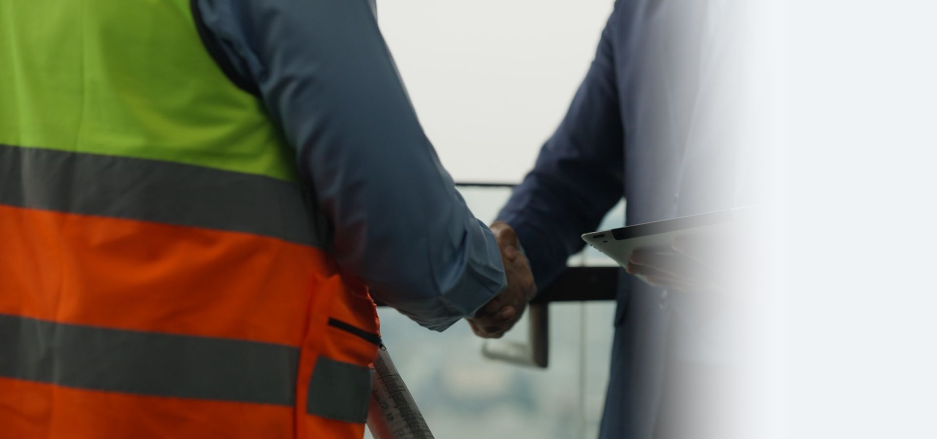 Handshake between a restoration business owner and an insurance advisor, representing restoration business insurance support and fast coverage decisions.